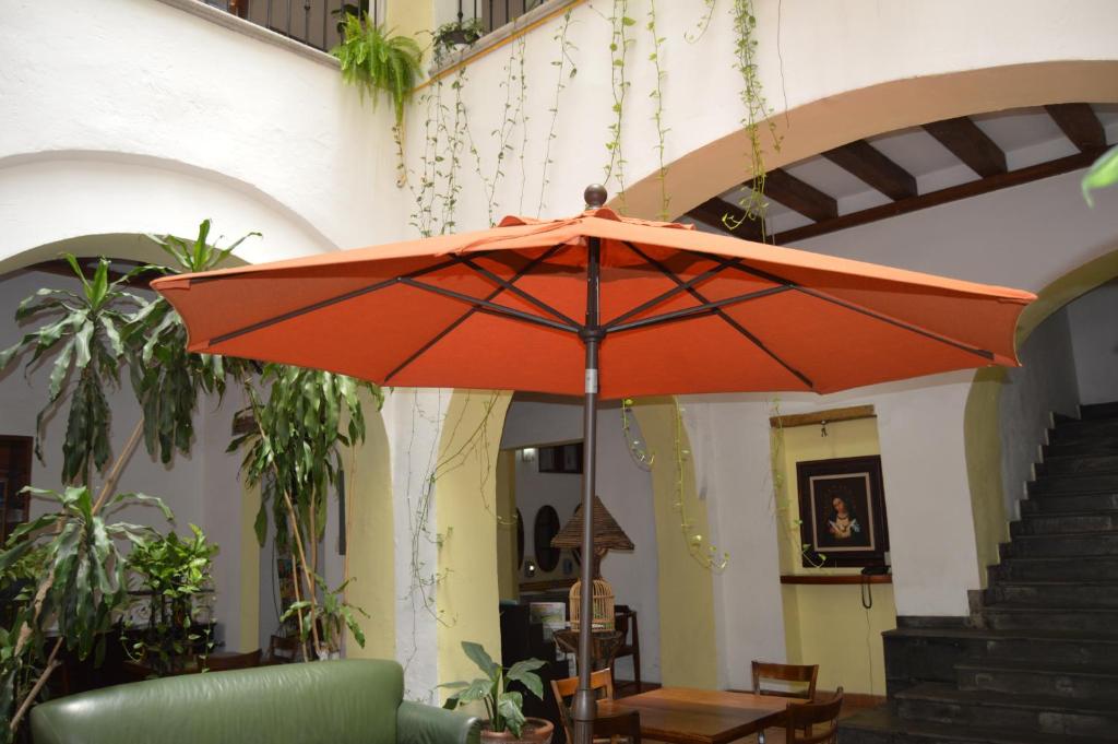 Courtyard and shaded seating at Hotel Meson del Mar